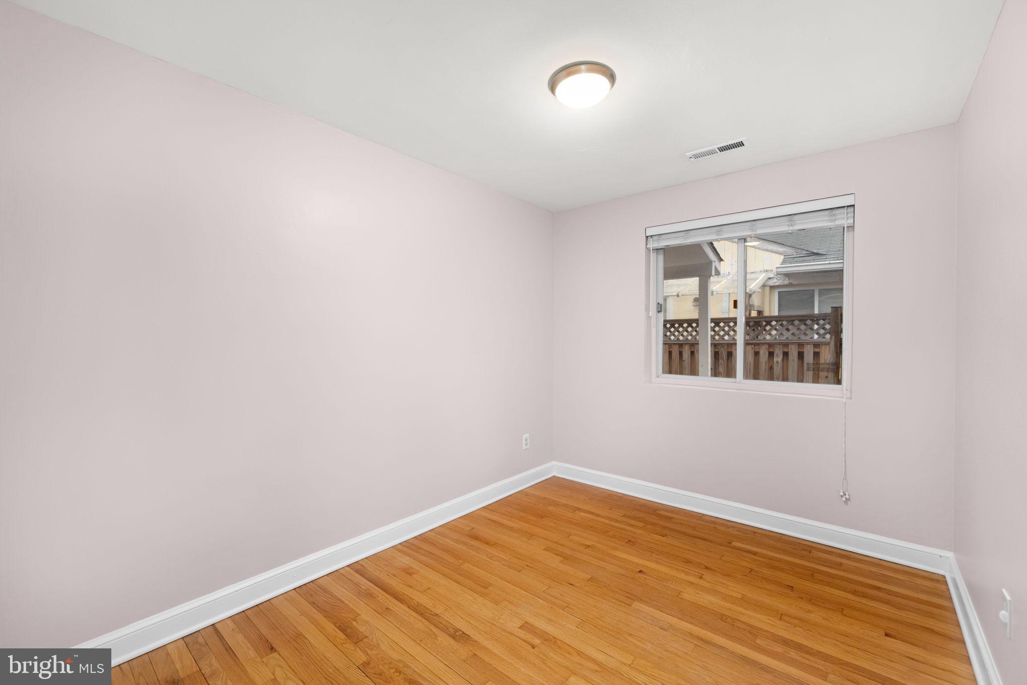 1615 45th Street Northwest Washington, DC 20007 - Photo 18 of 34 a view of empty room with wooden floor