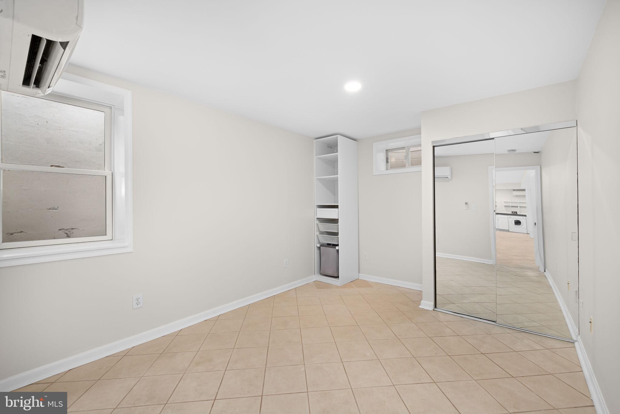1615 45th Street Northwest Washington, DC 20007 - Photo 25 of 34 an empty room with closet and windows