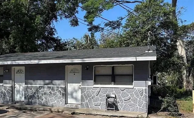 front view of a house with a bench