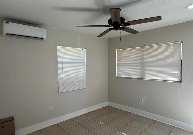 a view of an empty room with a window