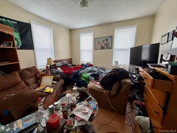 a bed room with furniture and a flat screen tv