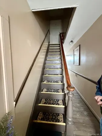 a living room with furniture and flowers