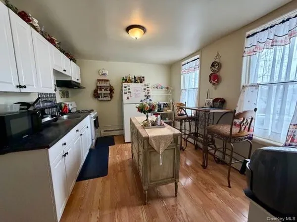 a very nice looking living room with wooden floor