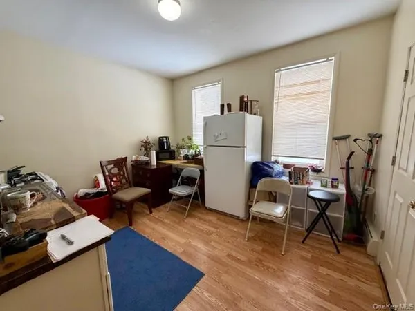 a work room with furniture and a window