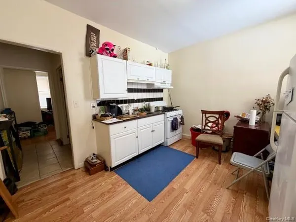 a kitchen with stainless steel appliances granite countertop a stove and a refrigerator
