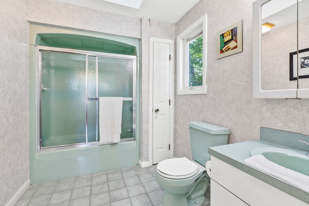 54 Jennifer Road Lowell, MA 01854 - Photo 12 of 23 a bathroom with a sink toilet and shower