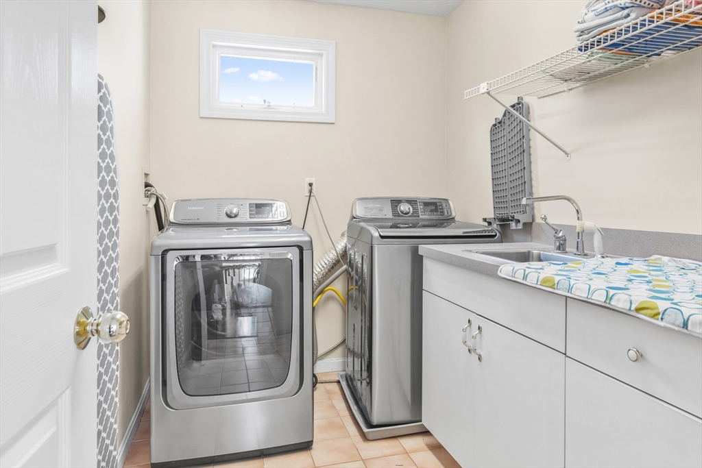 54 Jennifer Road Lowell, MA 01854 - Photo 14 of 23 a utility room with dryer and washer