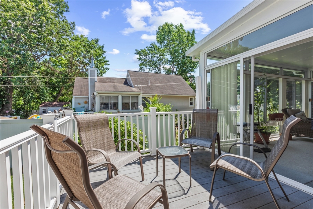 54 Jennifer Road Lowell, MA 01854 - Photo 19 of 23 a view of a chair and tables in the balcony