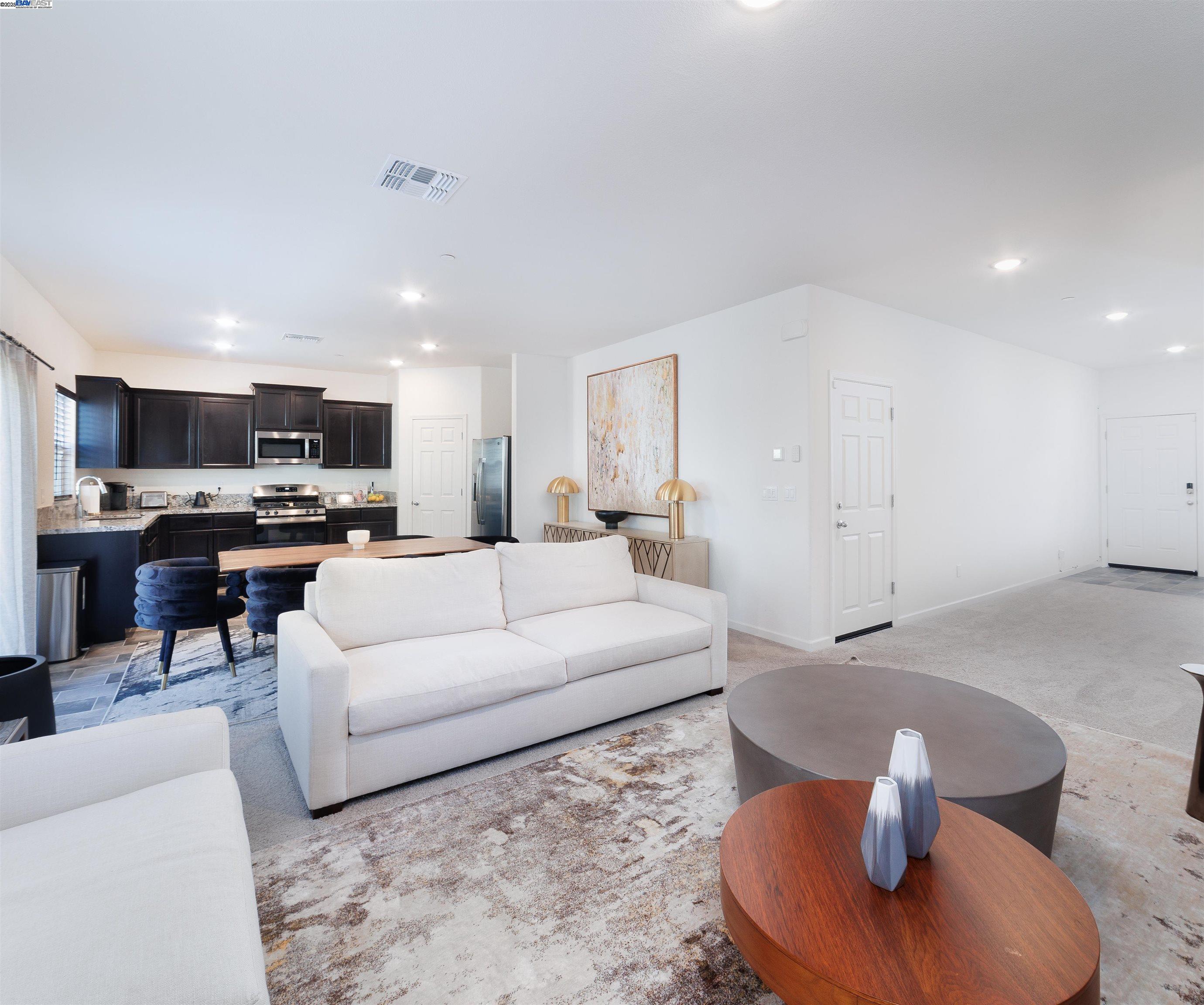 Van Buskirk Stockton, CA 95206 - Photo 5 of 14 a living room with furniture and a view of kitchen