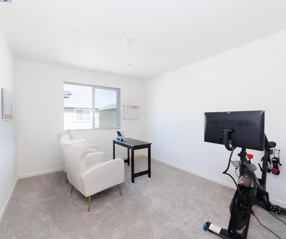 a bedroom with furniture and a window