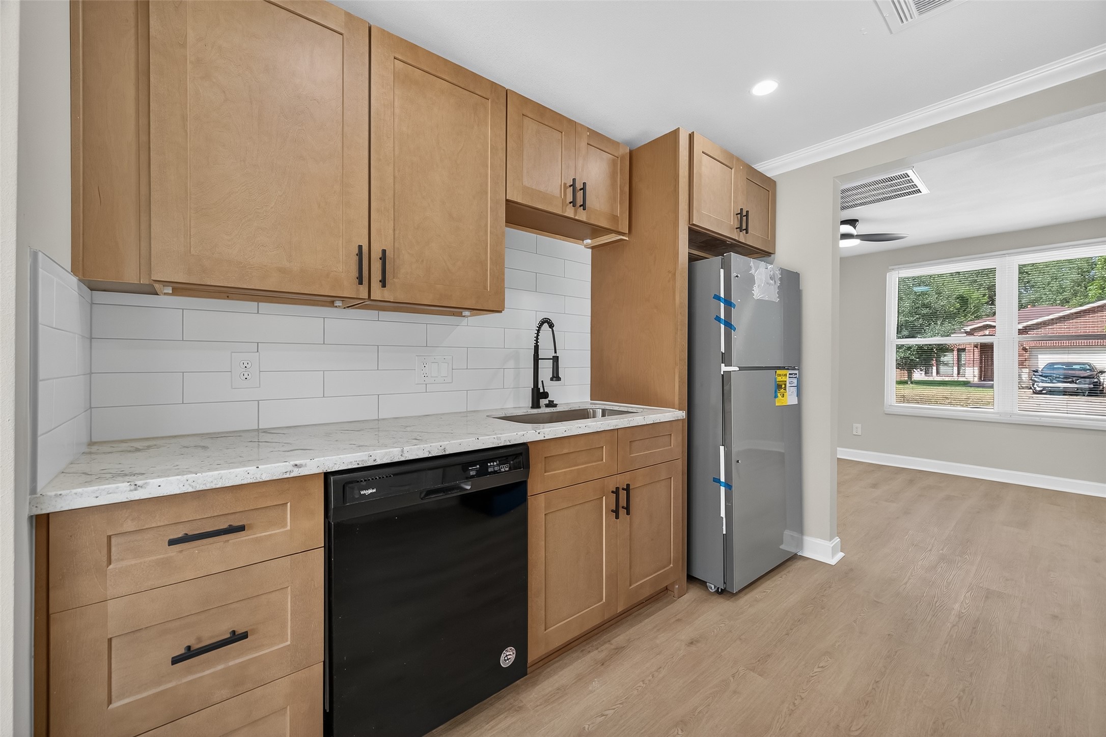 889 Chas Lane Houston, TX 77091 - Photo 11 of 32 a kitchen with stainless steel appliances granite countertop a refrigerator and cabinets