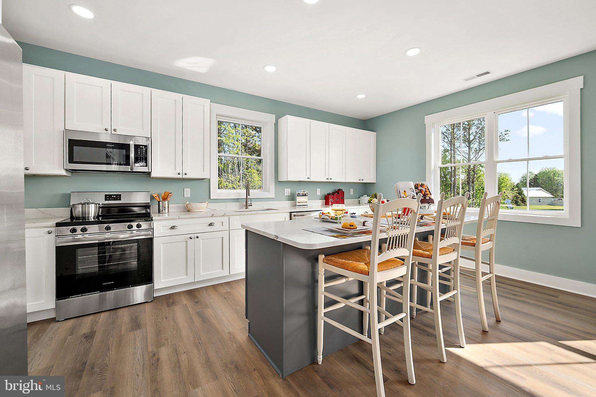 36037 Jackson Street Ocean View, DE 19970 - Photo 14 of 59 Bright and airy modern kitchen space.