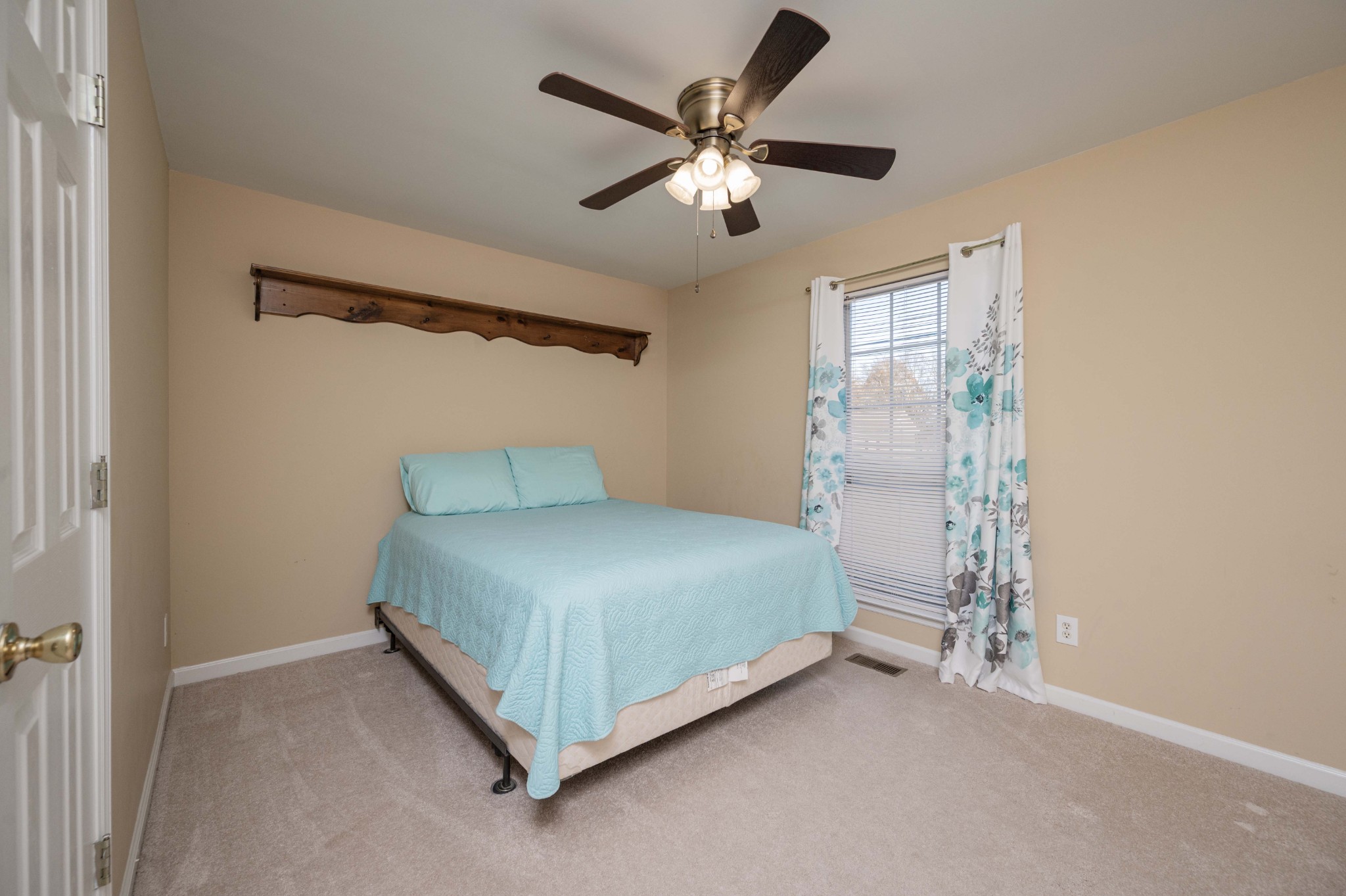 412 Conhocken Court Murfreesboro, TN 37128 - Photo 16 of 23 a bedroom with a bed and a ceiling fan