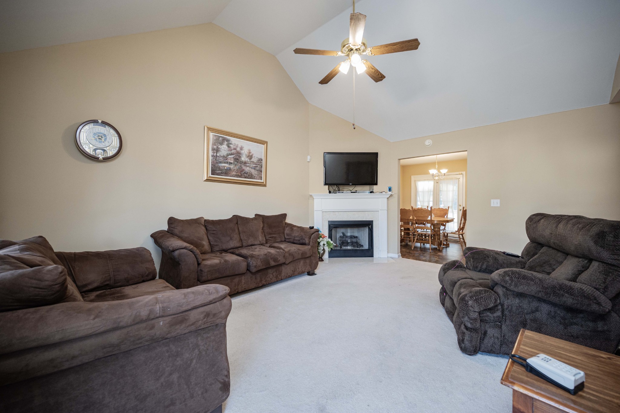 412 Conhocken Court Murfreesboro, TN 37128 - Photo 4 of 23 a living room with furniture fireplace and a flat screen tv