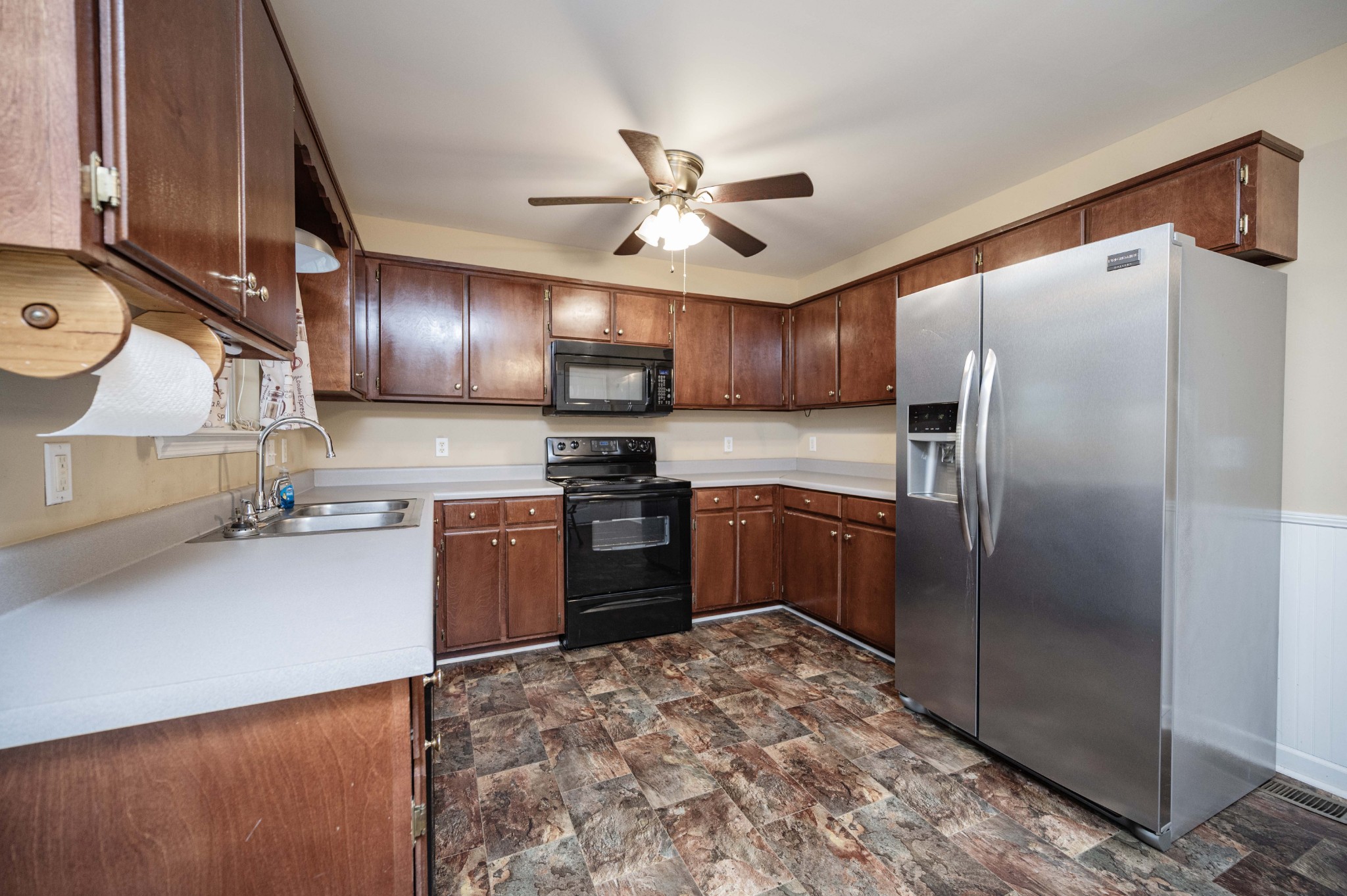 412 Conhocken Court Murfreesboro, TN 37128 - Photo 8 of 23 a kitchen with stainless steel appliances granite countertop a refrigerator a stove and a sink with wooden floor