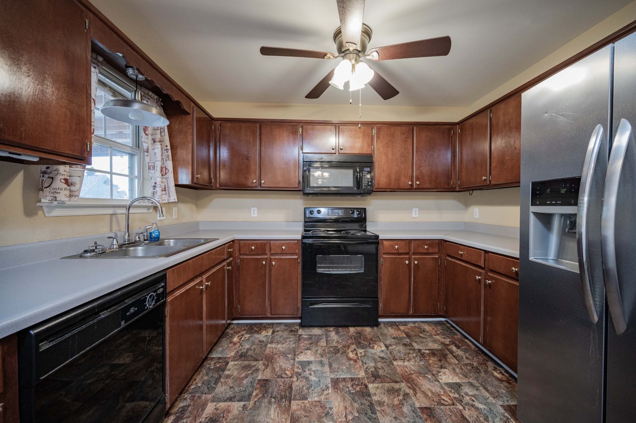 412 Conhocken Court Murfreesboro, TN 37128 - Photo 9 of 23 a kitchen with stainless steel appliances granite countertop a stove sink microwave and refrigerator