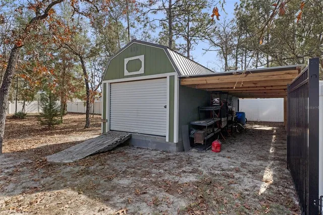 a view of a house with a yard and garage