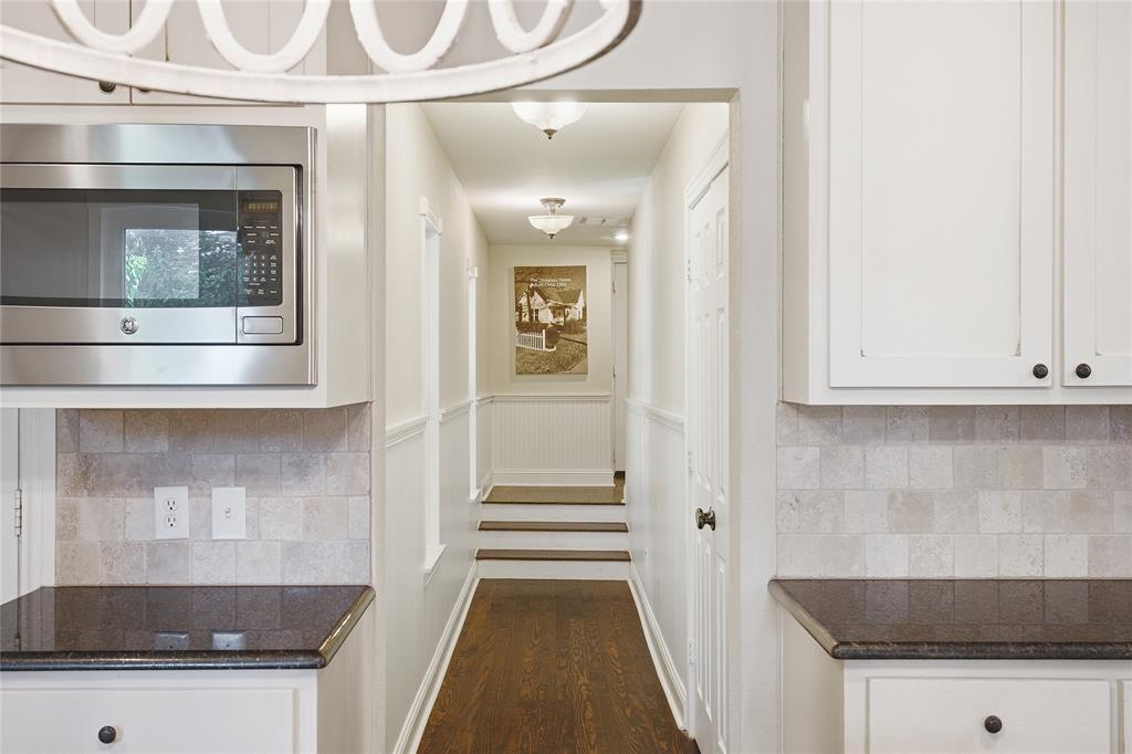 9121 6th Street Frisco, TX 75033 - Photo 8 of 27 a view of a hallway with wooden floor and staircase