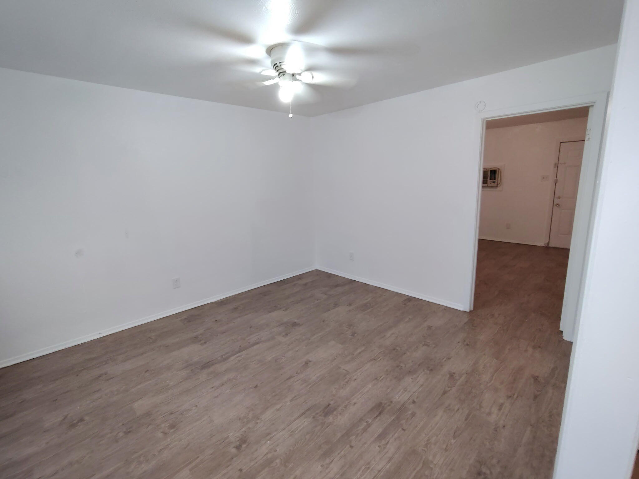 1110 41st Street, Unit B Lubbock, TX 79412 - Photo 8 of 8 wooden floor in an empty room