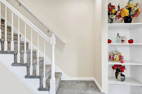 a kitchen with stainless steel appliances granite countertop a refrigerator sink and stove