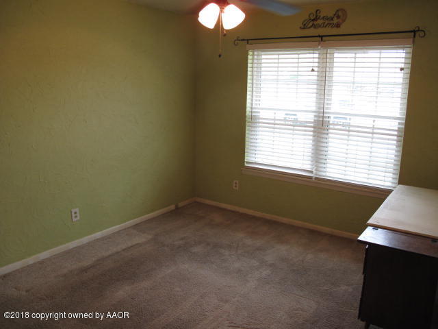 7201 Gainsborough Road Amarillo, TX 79106 - Photo 8 of 14 a room with window and a fan