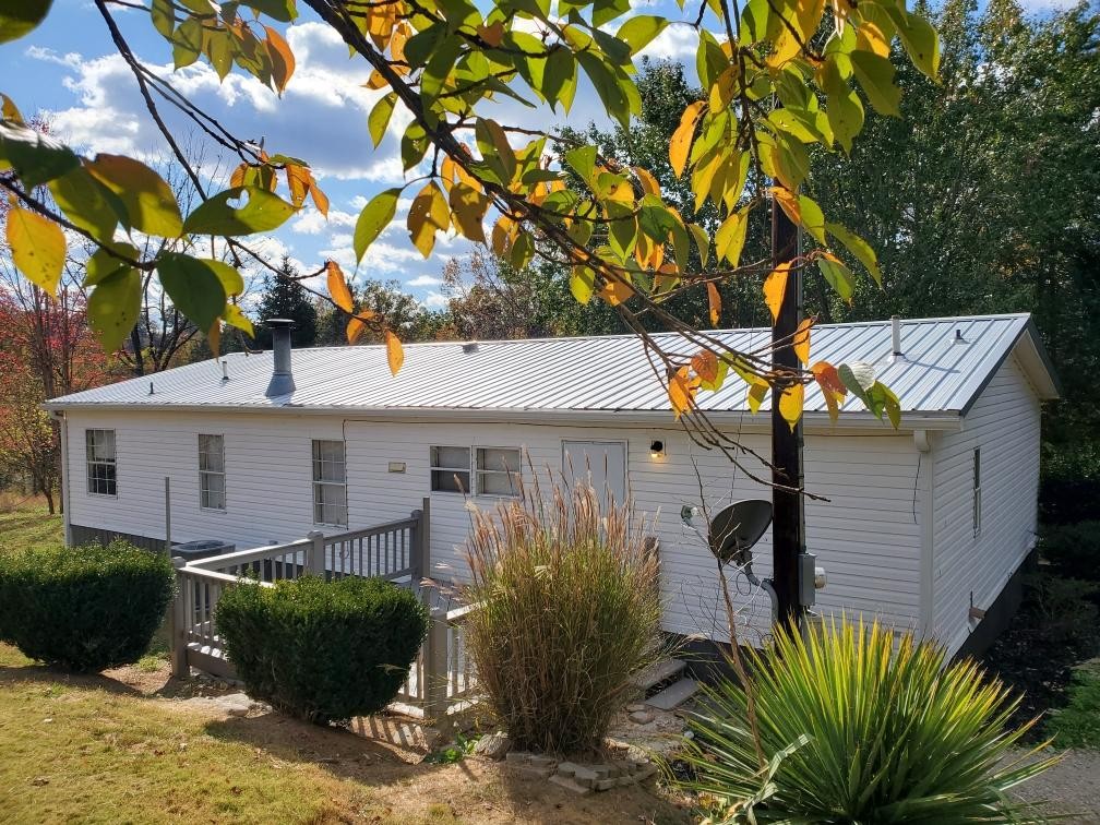 2990 Vanzant Bend Road Belvidere, TN 37306 - Photo 2 of 20 a front view of a house with garden