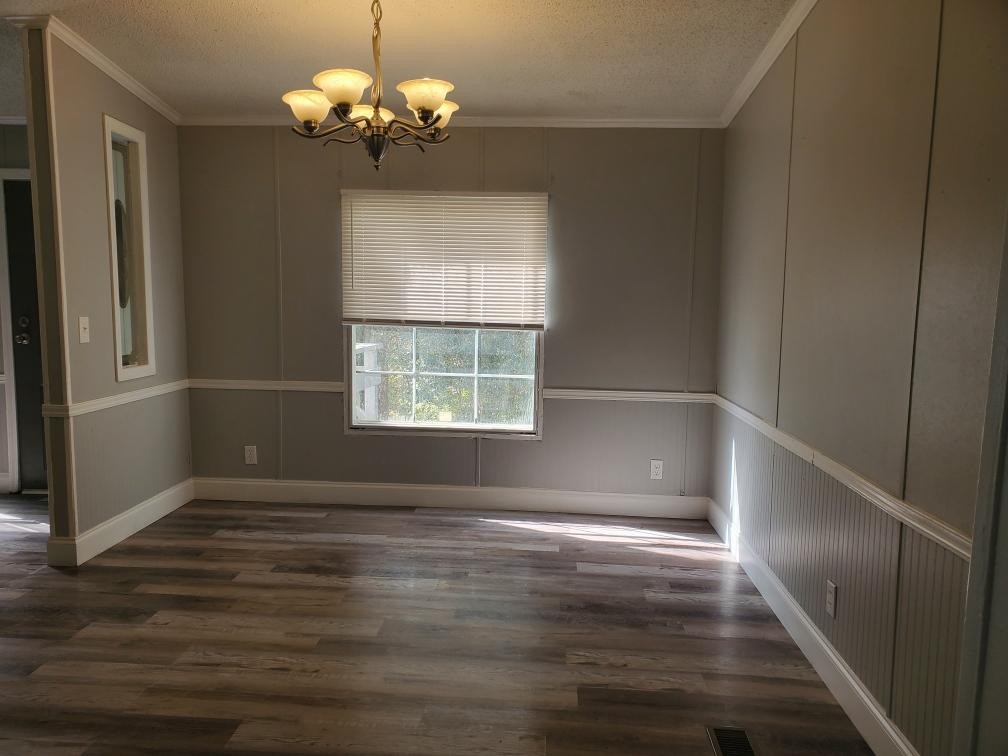 2990 Vanzant Bend Road Belvidere, TN 37306 - Photo 9 of 20 a view of an empty room with wooden floor and a window
