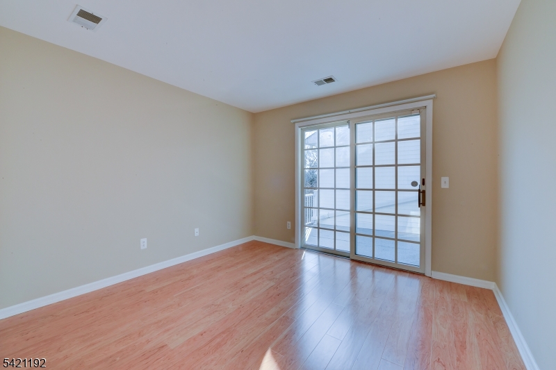 220 Alexandria Way Bernards, NJ 07920 - Photo 17 of 18 wooden floor in an empty room with a window