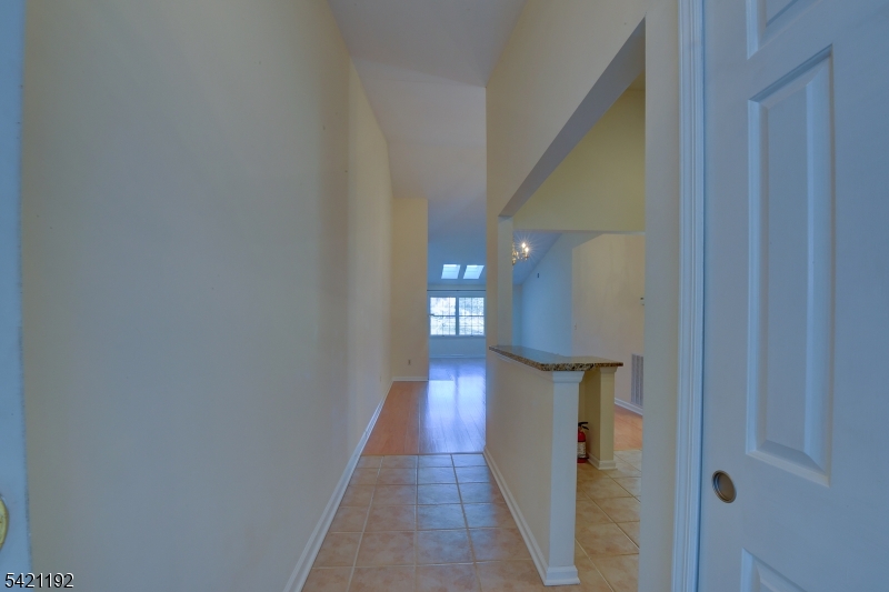 220 Alexandria Way Bernards, NJ 07920 - Photo 7 of 18 a view of a hallway with wooden floor