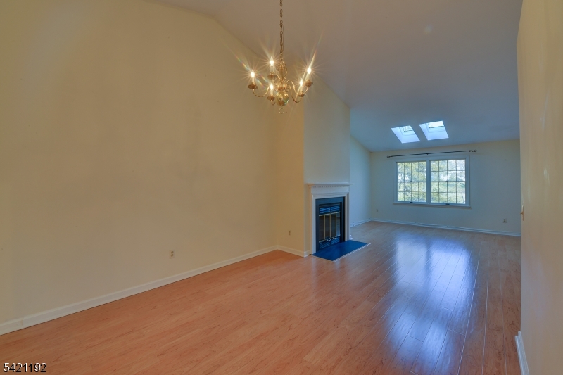 220 Alexandria Way Bernards, NJ 07920 - Photo 10 of 18 wooden floor in an empty room with a window