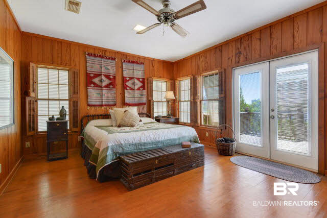 30234 River Road Orange Beach, AL 36561 - Photo 8 of 23 Master bedroom opens to a private 10 X 20 deck overlooking Old River.