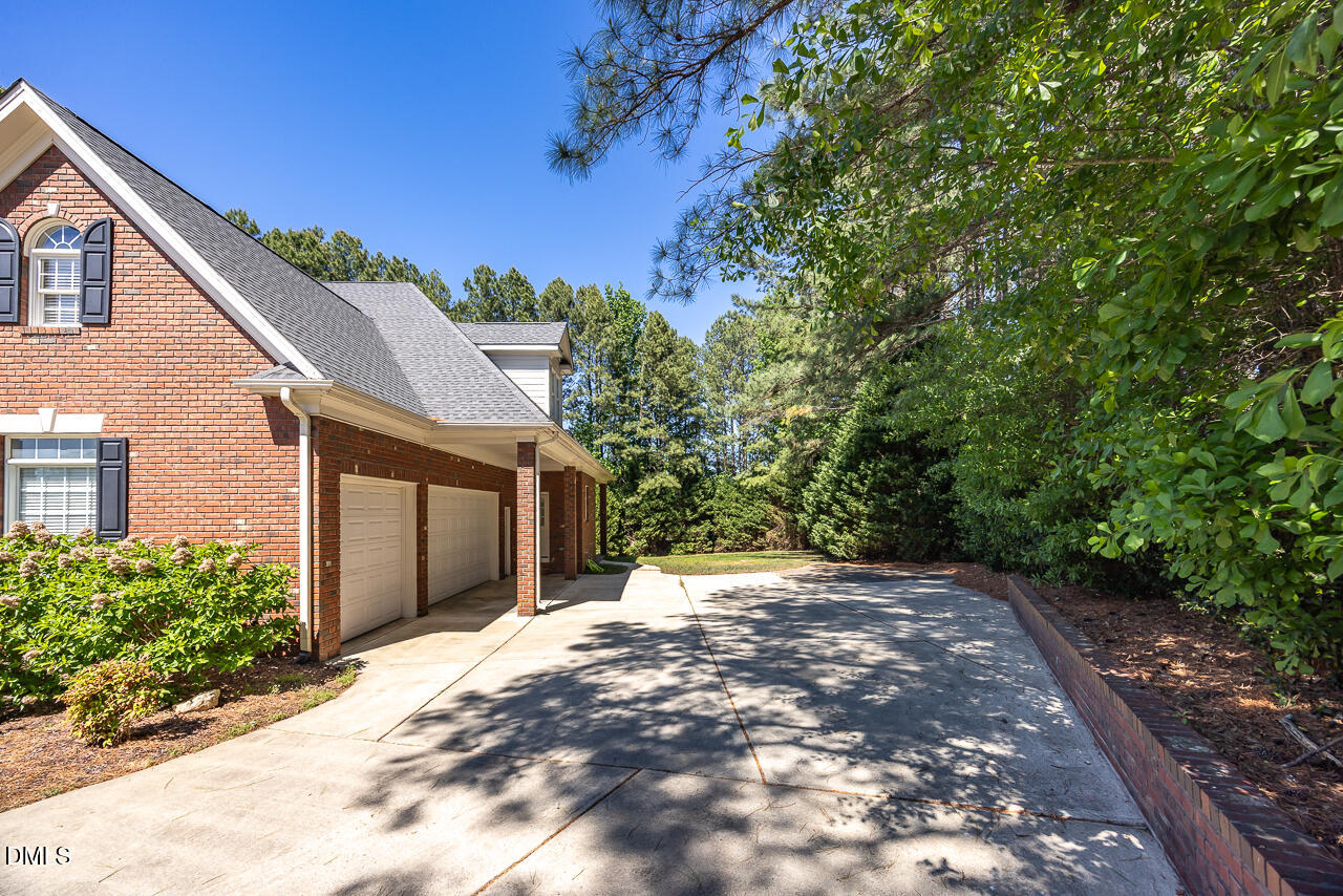 4004 Frontenac Court Apex, NC 27539 - Photo 60 of 61 a view of a yard with a house