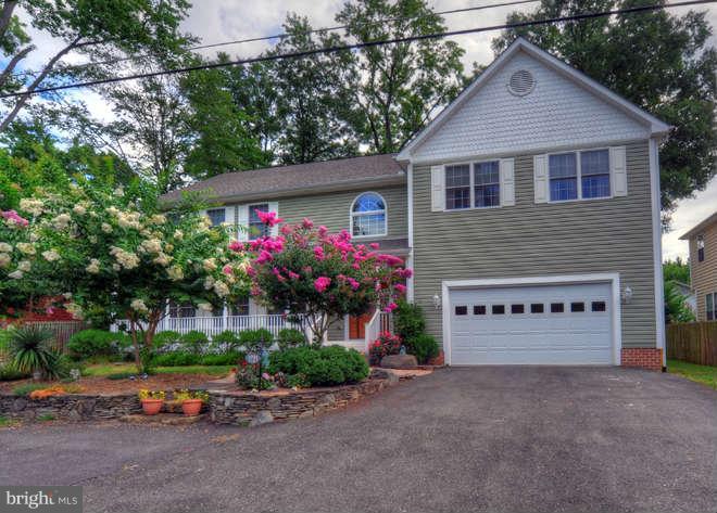 1721 Tacoma Road Edgewater, MD 21037 - Photo 1 of 30 a front view of house with yard