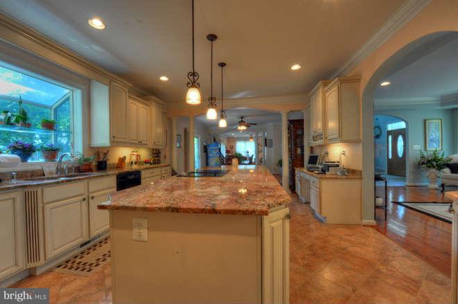 1721 Tacoma Road Edgewater, MD 21037 - Photo 10 of 30 a kitchen with stainless steel appliances granite countertop sink stove and refrigerator