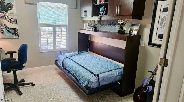 a bedroom with a bed and furniture