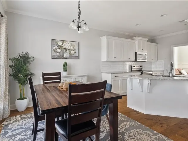 a view of kitchen with cabinets and wooden floor