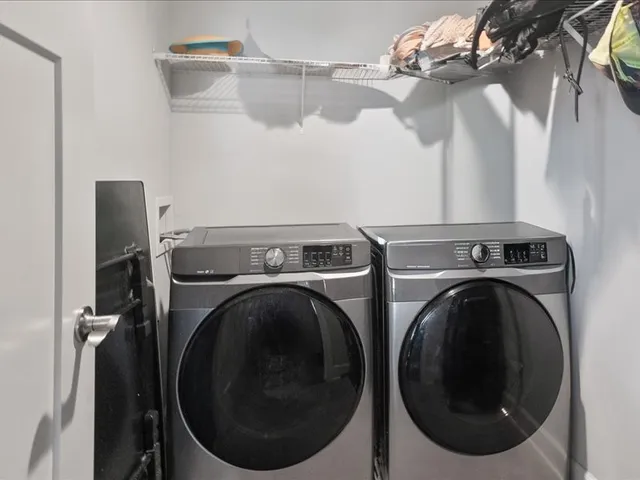 a view of a storage & utility room with a washer and dryer