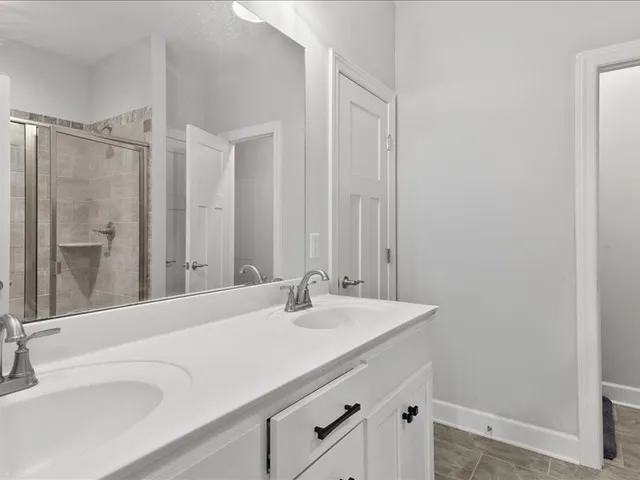 a bathroom with a sink and a large mirror