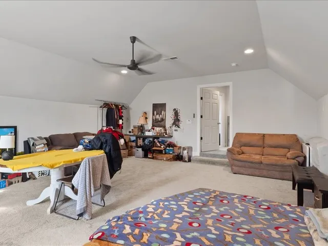 a bedroom with furniture and a chandelier