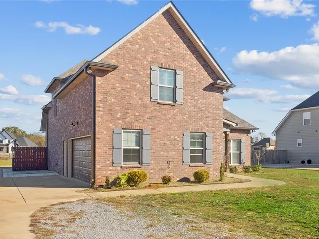a view of pool with yard