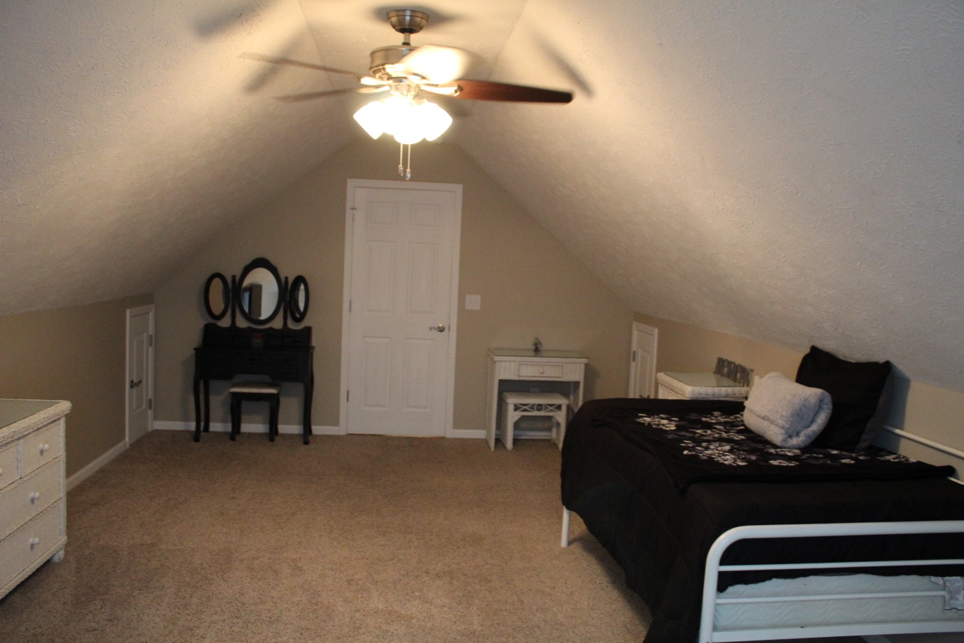 100 Houston Bell Road Manchester, TN 37355 - Photo 42 of 52 a bedroom with a bed and a chandelier