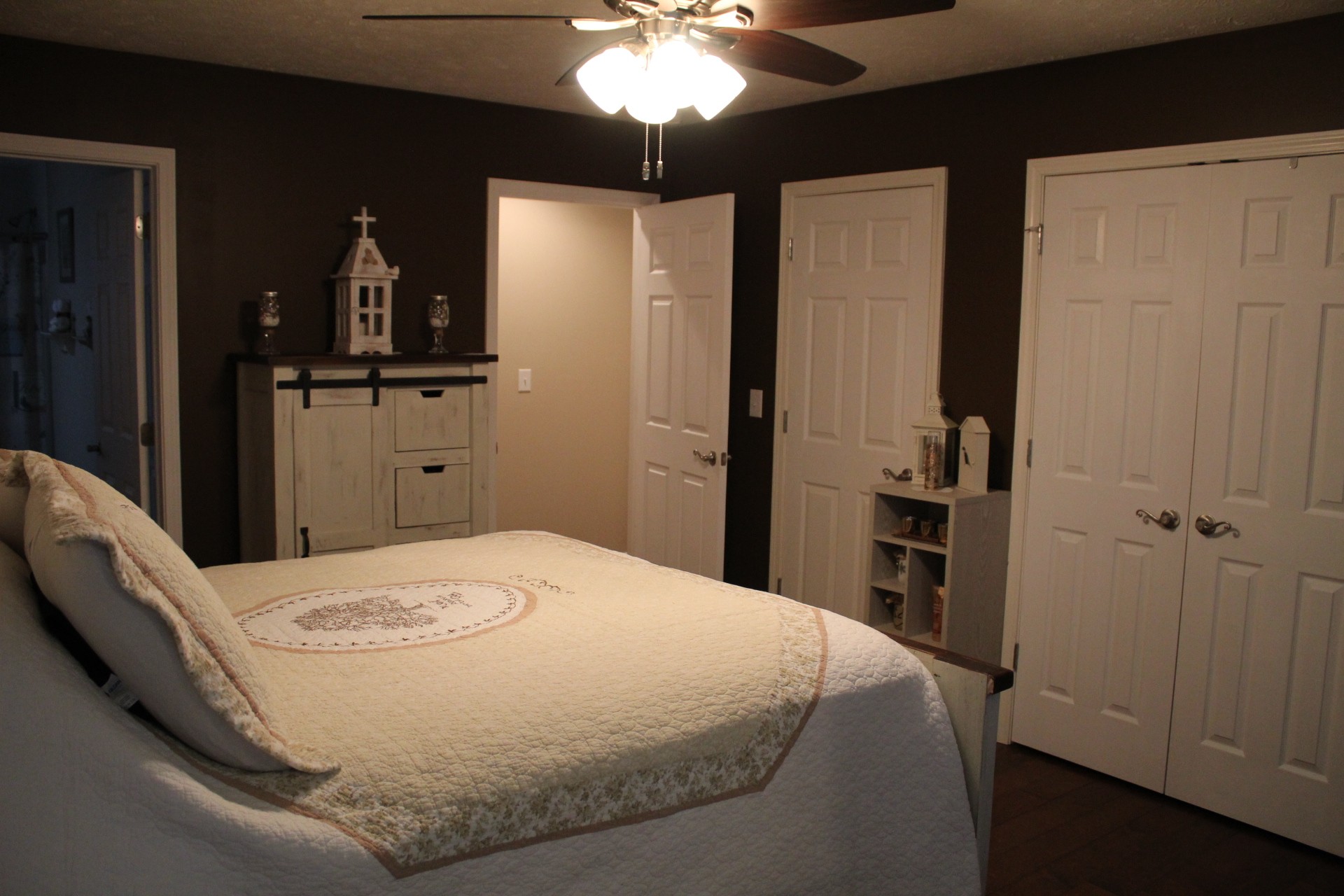 100 Houston Bell Road Manchester, TN 37355 - Photo 8 of 52 a bedroom with a bed and a chandelier