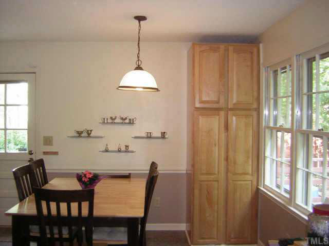 1436 Clermont Road Durham, NC 27713 - Photo 3 of 10 a view of a dining room with furniture window and outside view
