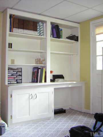 1436 Clermont Road Durham, NC 27713 - Photo 7 of 10 a room with a book shelf