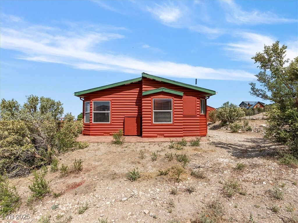 70 West Bonanza Road Las Vegas, NV 89124 - Photo 42 of 71 View of side of property featuring faux log siding
