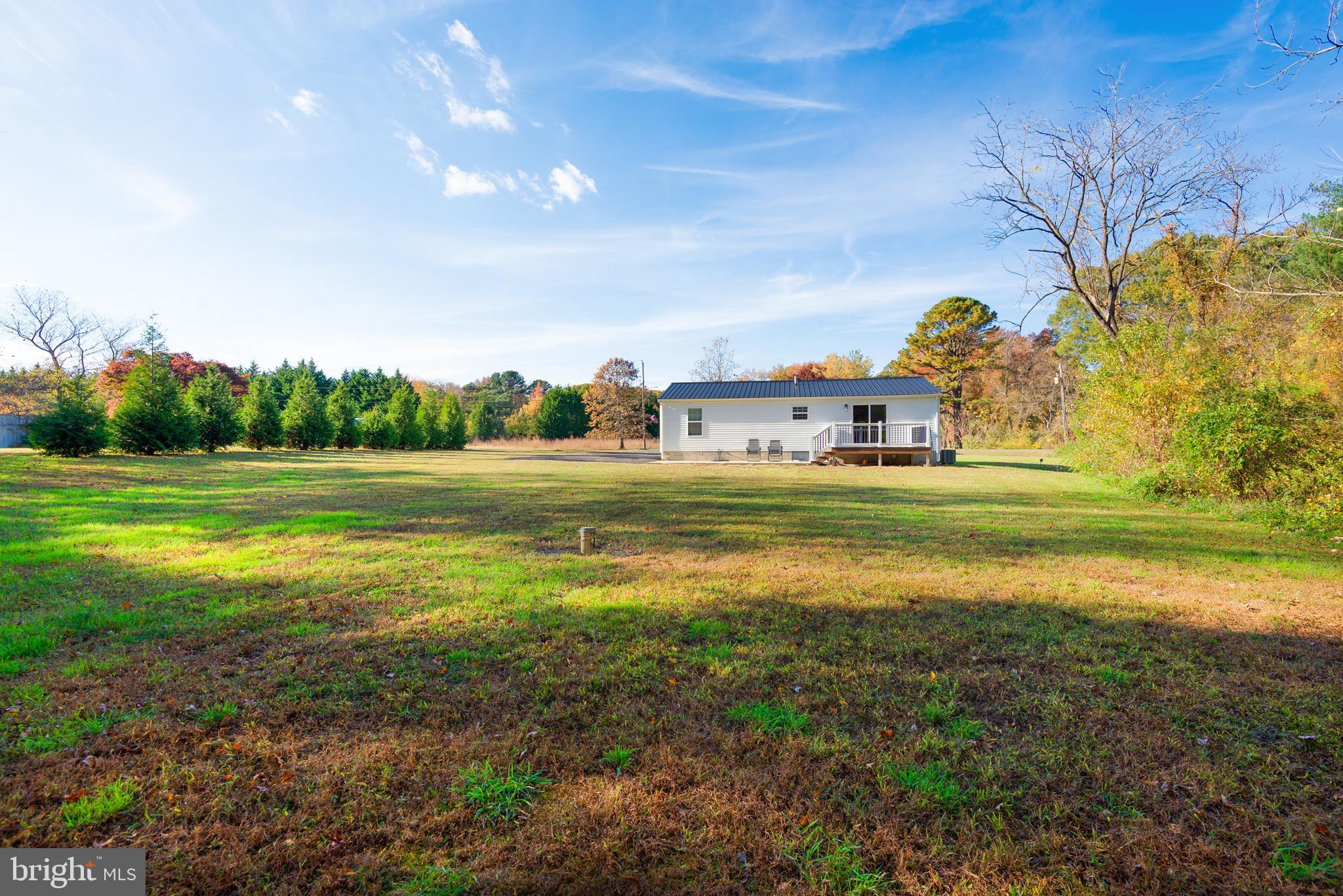 25607 Garey Road Denton, MD 21629 - Photo 4 of 19 a backyard of a building and trees in the background
