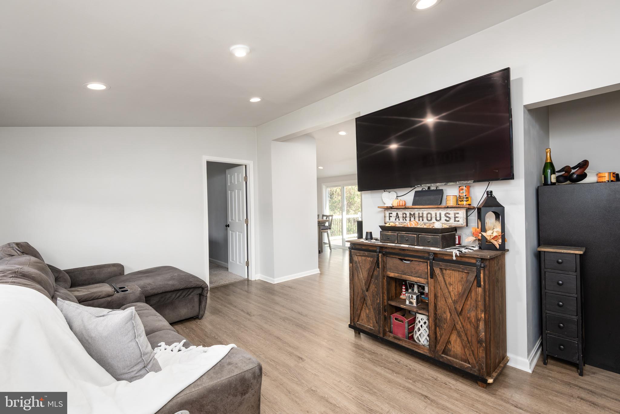 25607 Garey Road Denton, MD 21629 - Photo 5 of 19 a living room with furniture and a flat screen tv