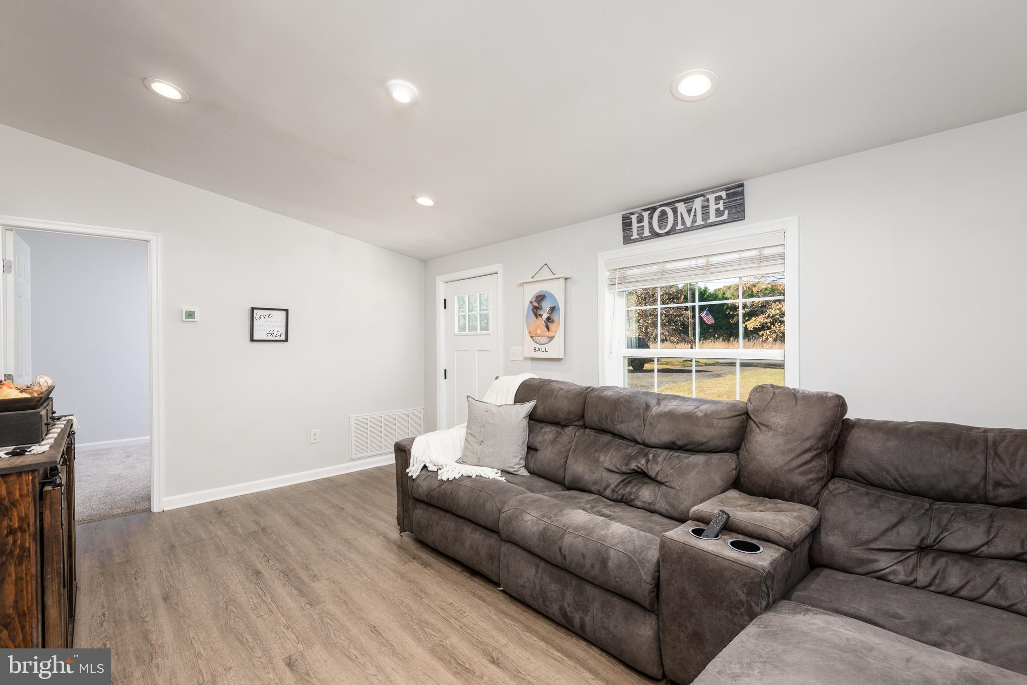 25607 Garey Road Denton, MD 21629 - Photo 6 of 19 a living room with furniture and a window