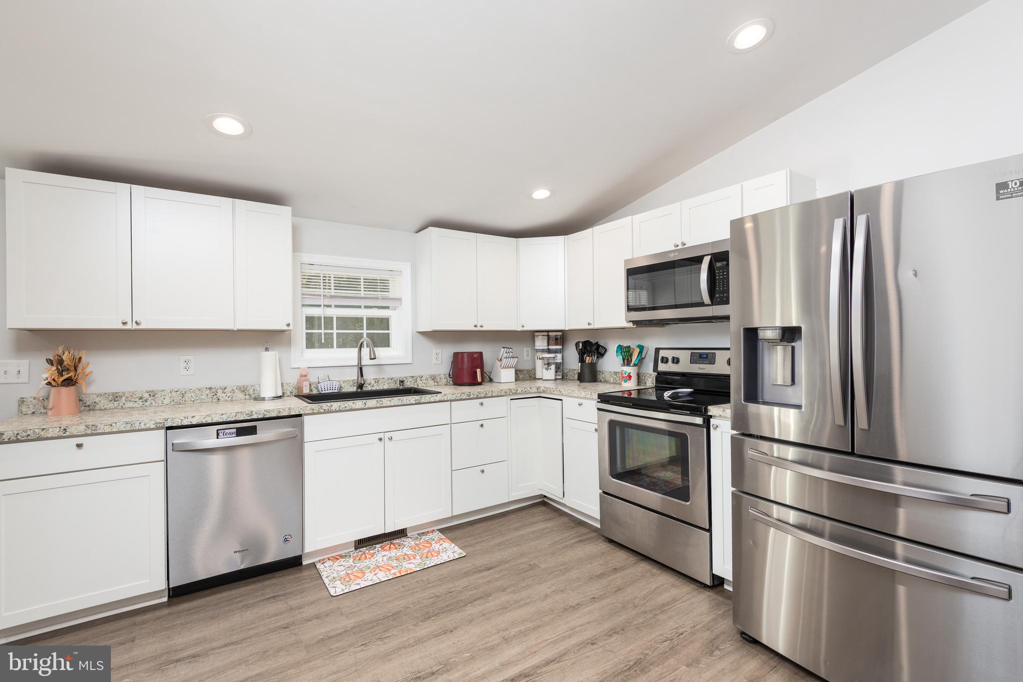 25607 Garey Road Denton, MD 21629 - Photo 8 of 19 a kitchen with a sink stainless steel appliances and window