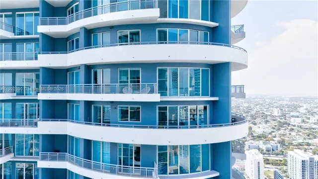 a front view of a building with a lot of windows